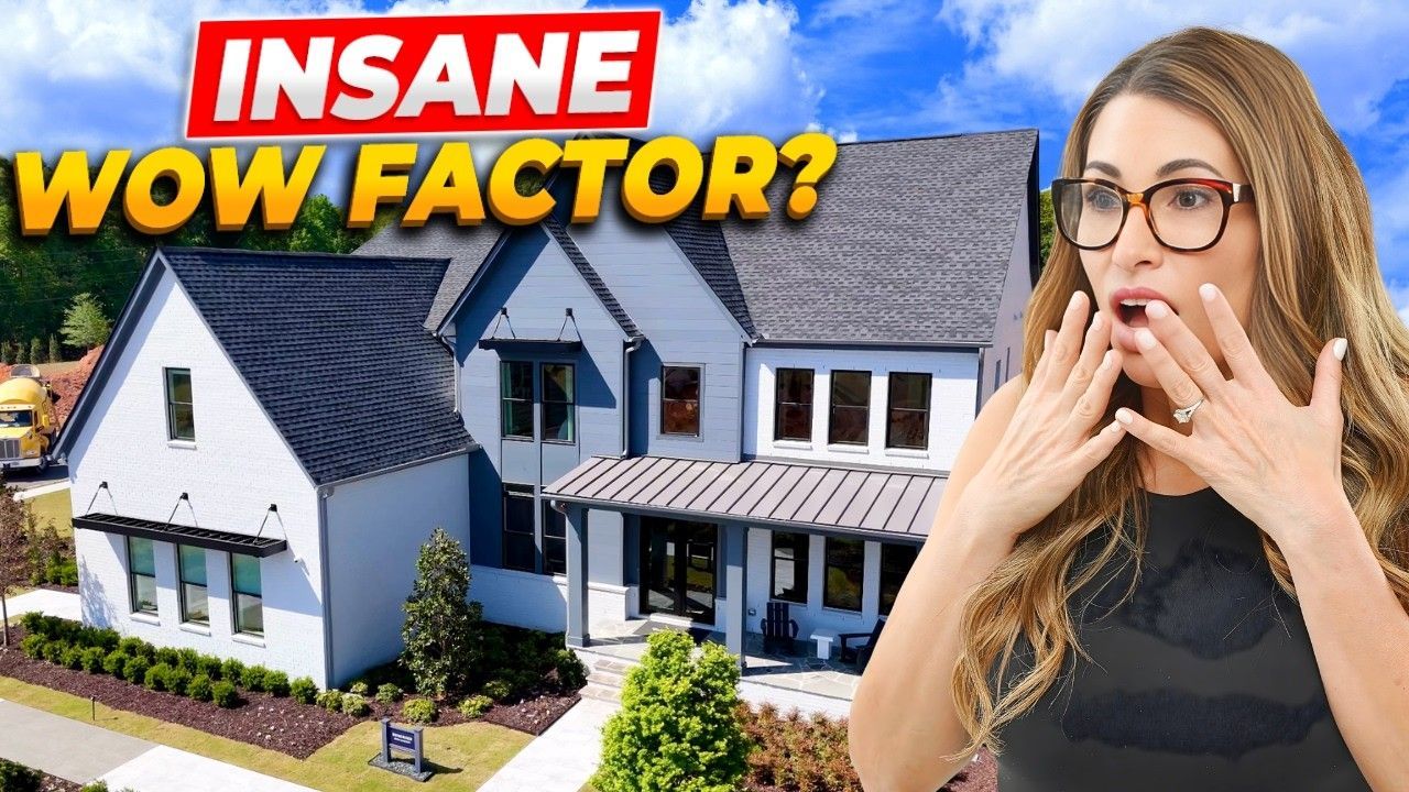 A modern home with a landscaped yard, featuring a woman expressing surprise in front of the house.