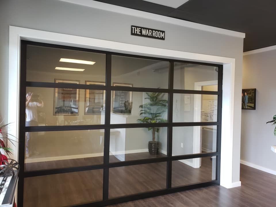 Interior commercial glass garage door used for office or showroom