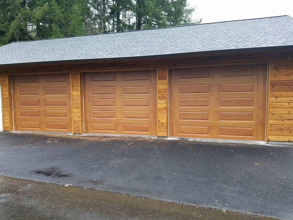 Row of wood garage doors on multi-bay residential garage