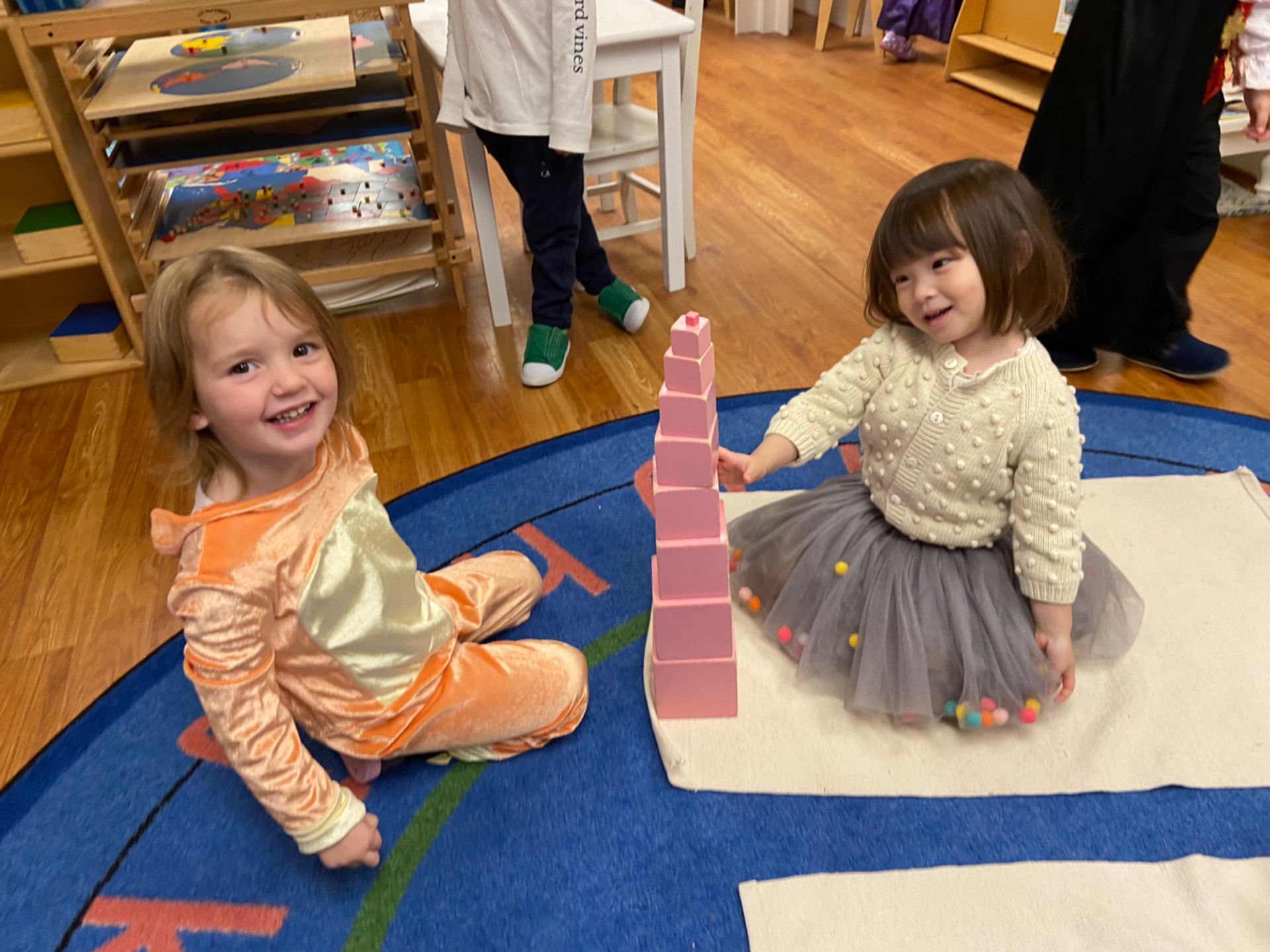 Montessori child working with montessori pink tower