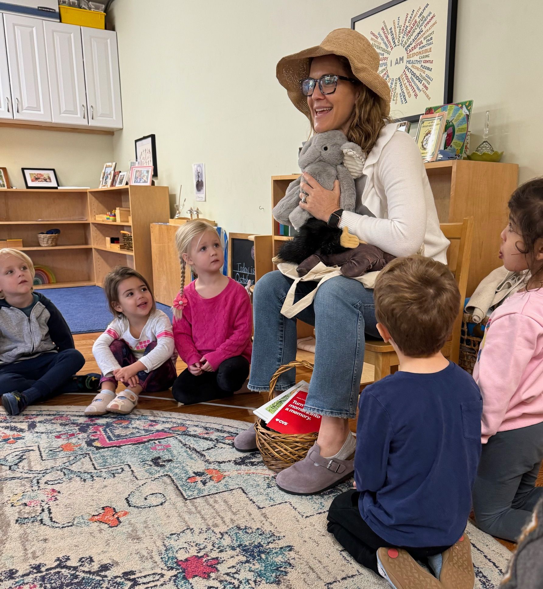 Montessori guide and children during lesson
