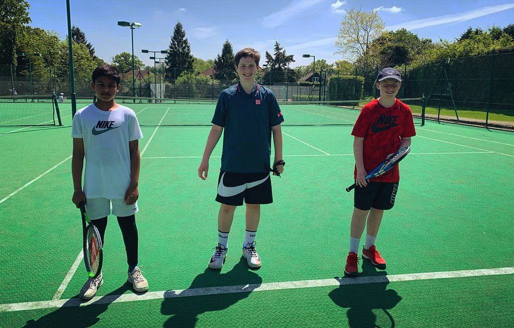 An image of three junior tennis players at Pinner Lawn Tennis Club