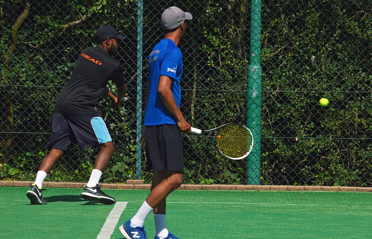 An image of four male tennis players at Pinner Lawn Tennis Club