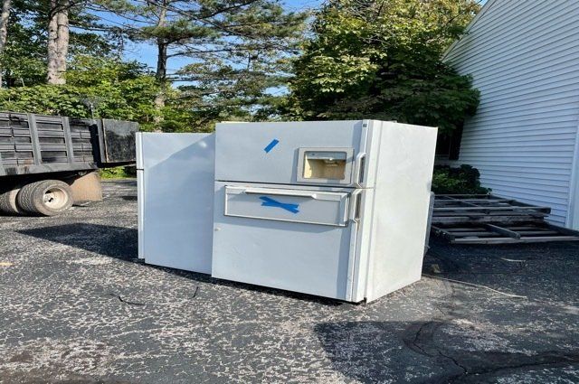 2 Refrigerators in Driveway