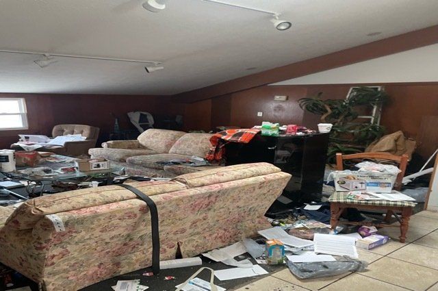 Room filled with furniture and trash