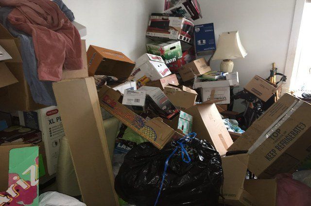 Room filled over three feet high with mostly empty cardboard boxes