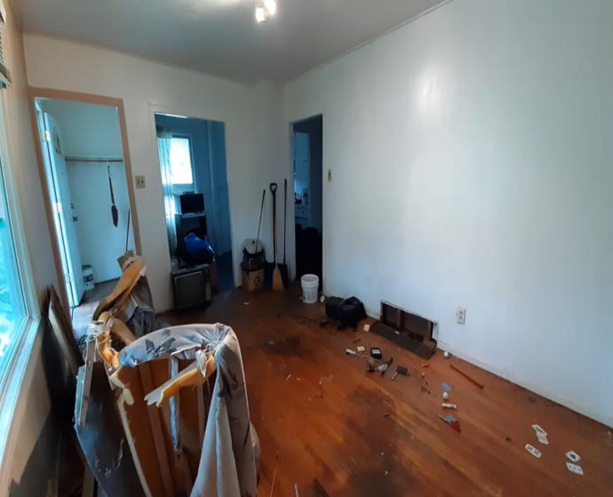 A room left in disarray after an eviction. Random items and junk sorted out through the home