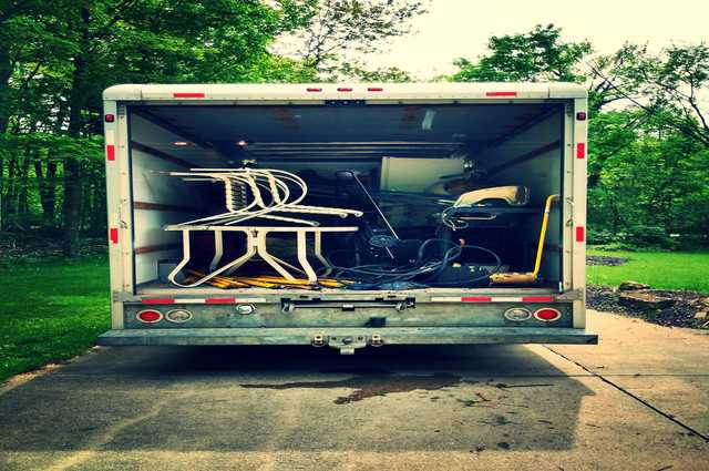 an open box truck that is loaded with items from a foreclosure cleanout