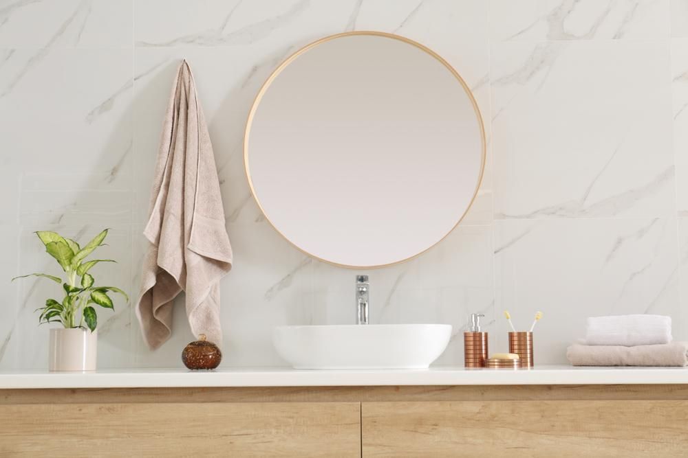 A Bathroom With A Sink , Mirror And Towel Hanging On The Wall — Viison Kitchens & Joinery Forster In Port Macquarie, NSW