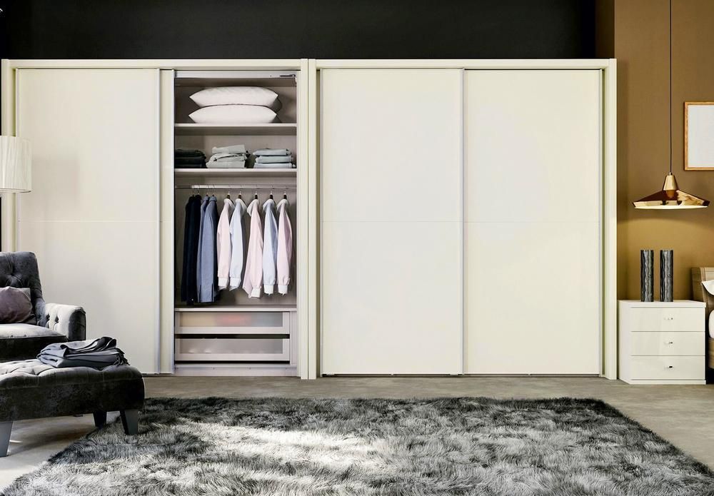 A Living Room With A Sliding Door Wardrobe And A Rug — Viison Kitchens & Joinery Forster In Wingham, NSW