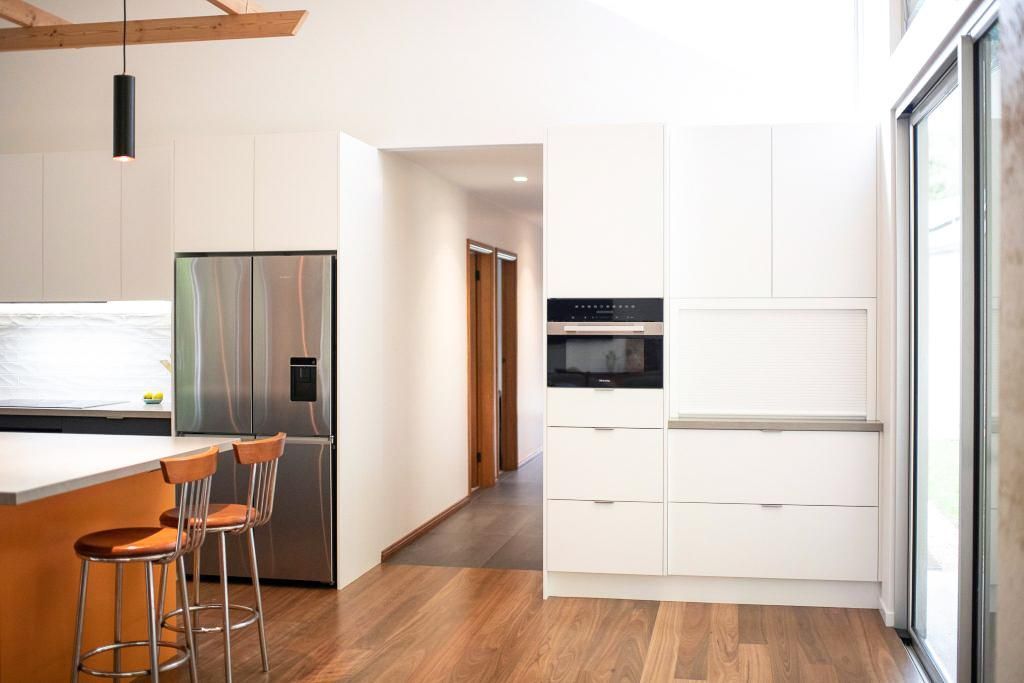 A Kitchen With White Cabinets And Stainless Steel Appliances — Viison Kitchens & Joinery Forster In Wingham, NSW