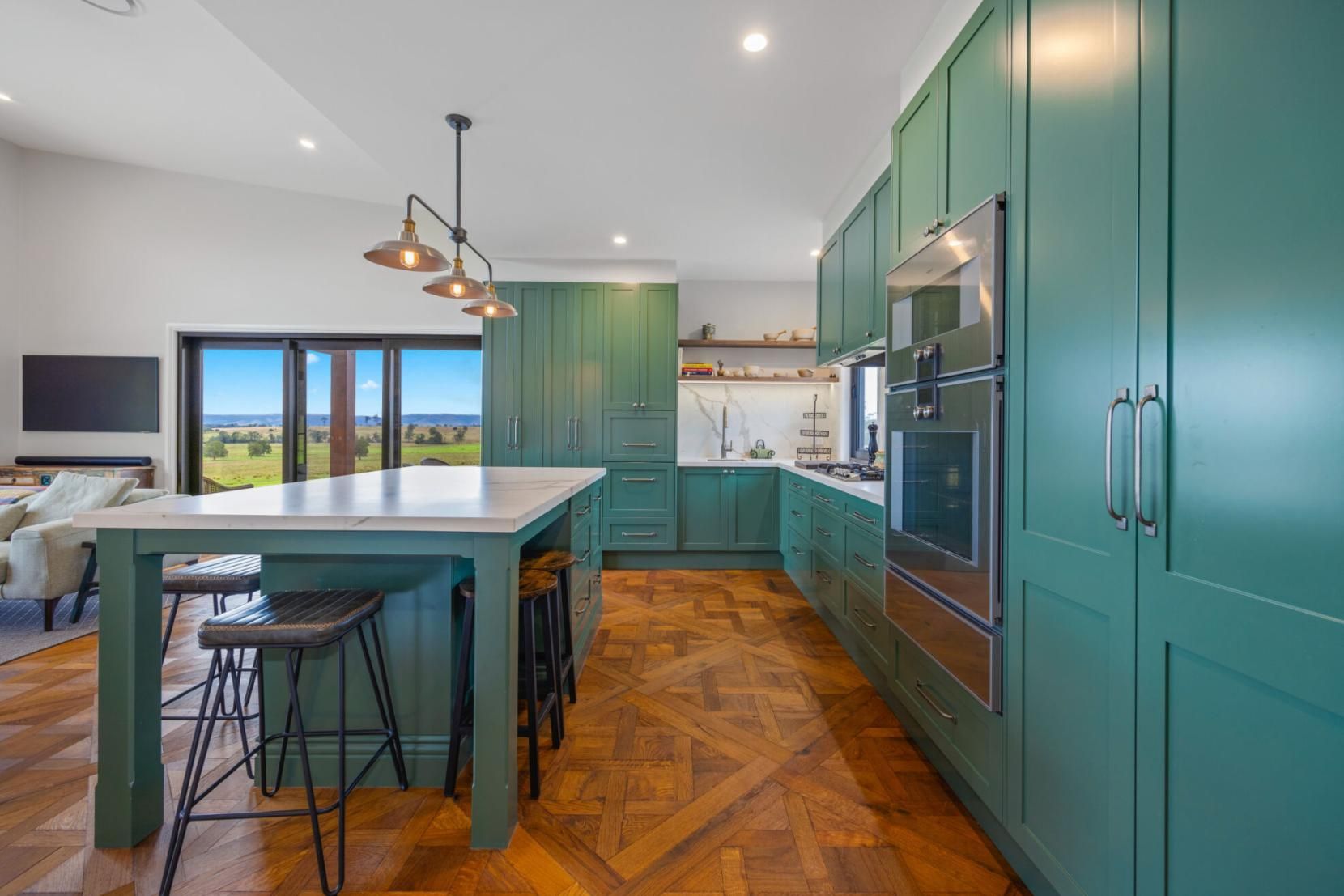 A Kitchen With Green Cabinets And A Large Island — Viison Kitchens & Joinery Forster In Forster, NSW