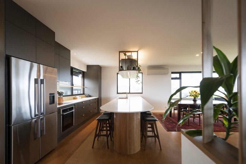 A Kitchen With Stainless Steel Appliances And A Large Island — Viison Kitchens & Joinery Forster In Forster, NSW
