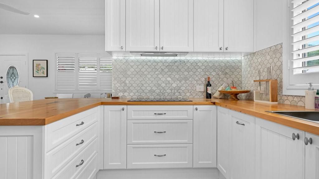 A Kitchen With White Cabinets And Wooden Counter Tops — Viison Kitchens & Joinery Forster In Port Macquarie, NSW