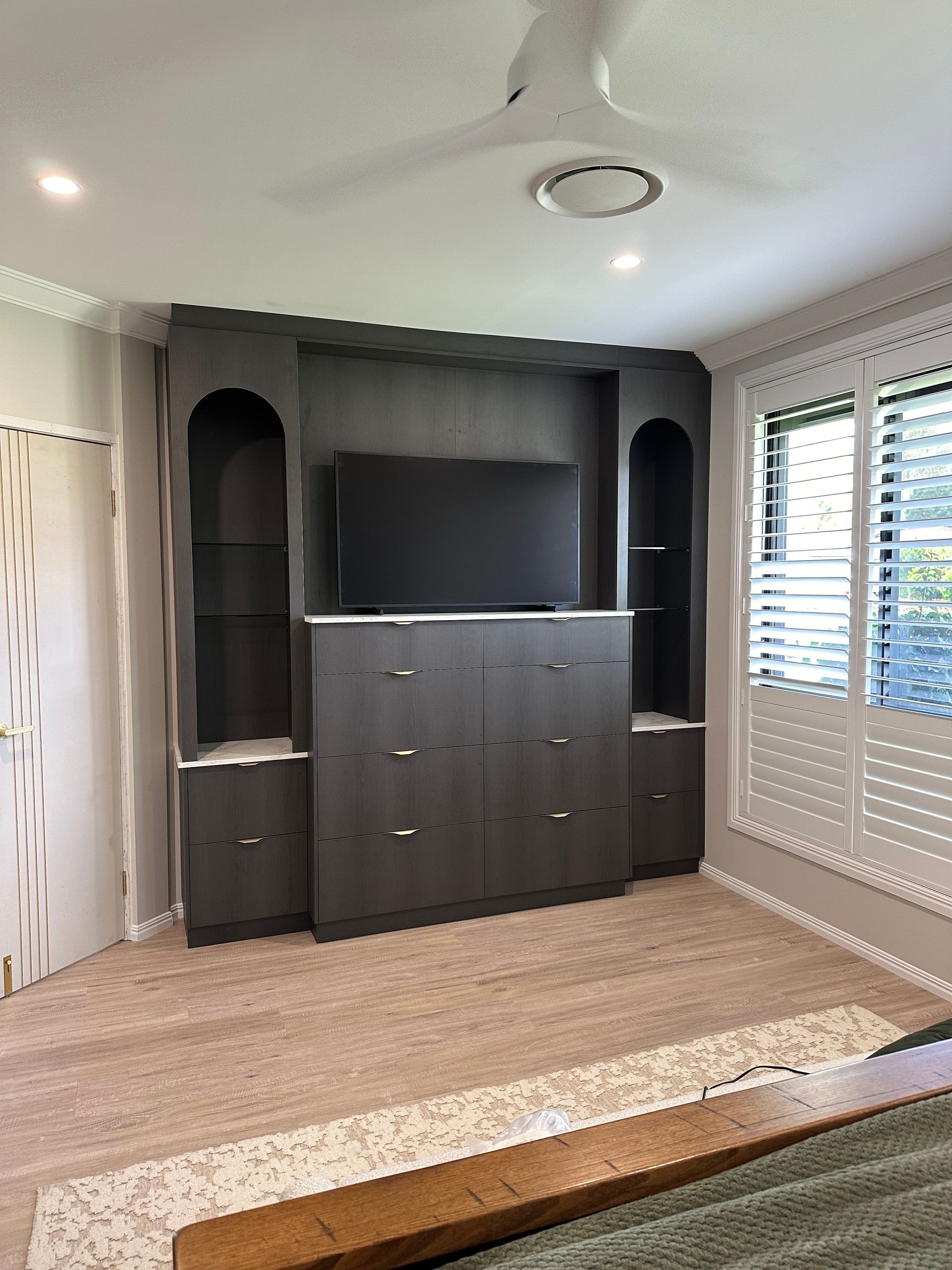 A Living Room Filled With Furniture And A Flat Screen Tv — Viison Kitchens & Joinery Forster In Forster, NSW