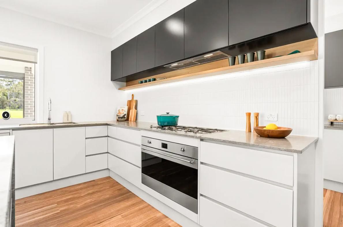A Kitchen With A Large Island In The Middle Of It — Viison Kitchens & Joinery Forster In Forster, NSW