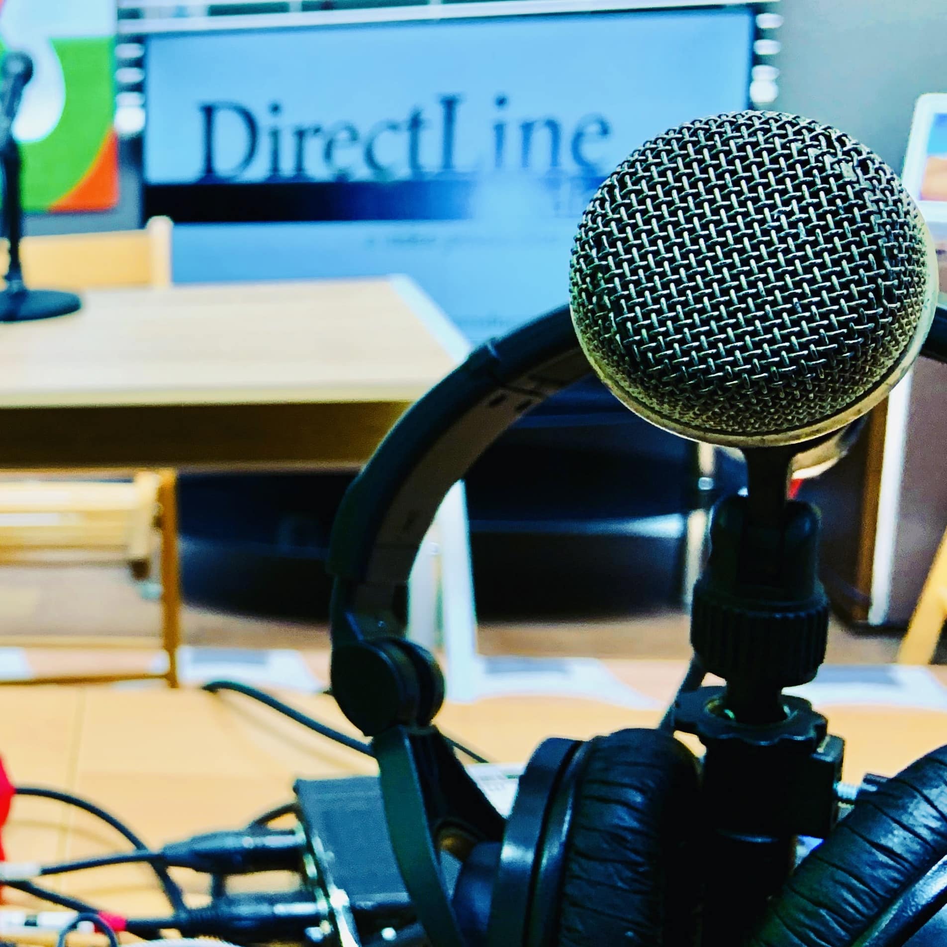 A microphone sits in front of a sign that says directline