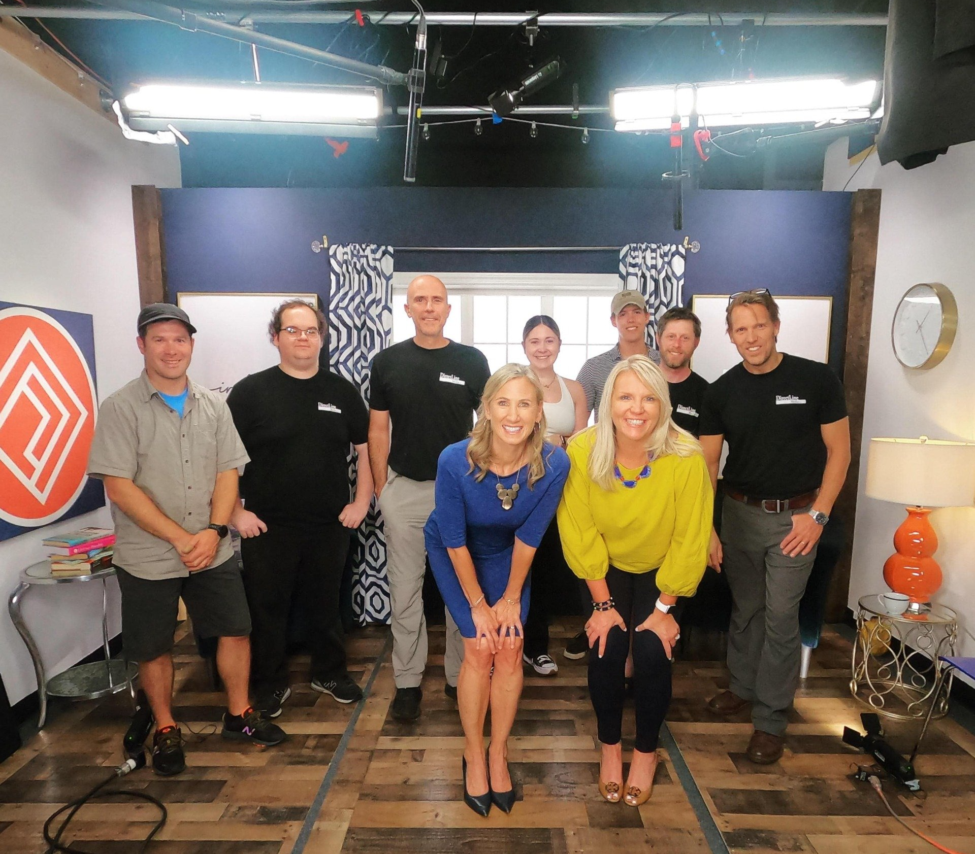 A group of people posing for a picture in a room