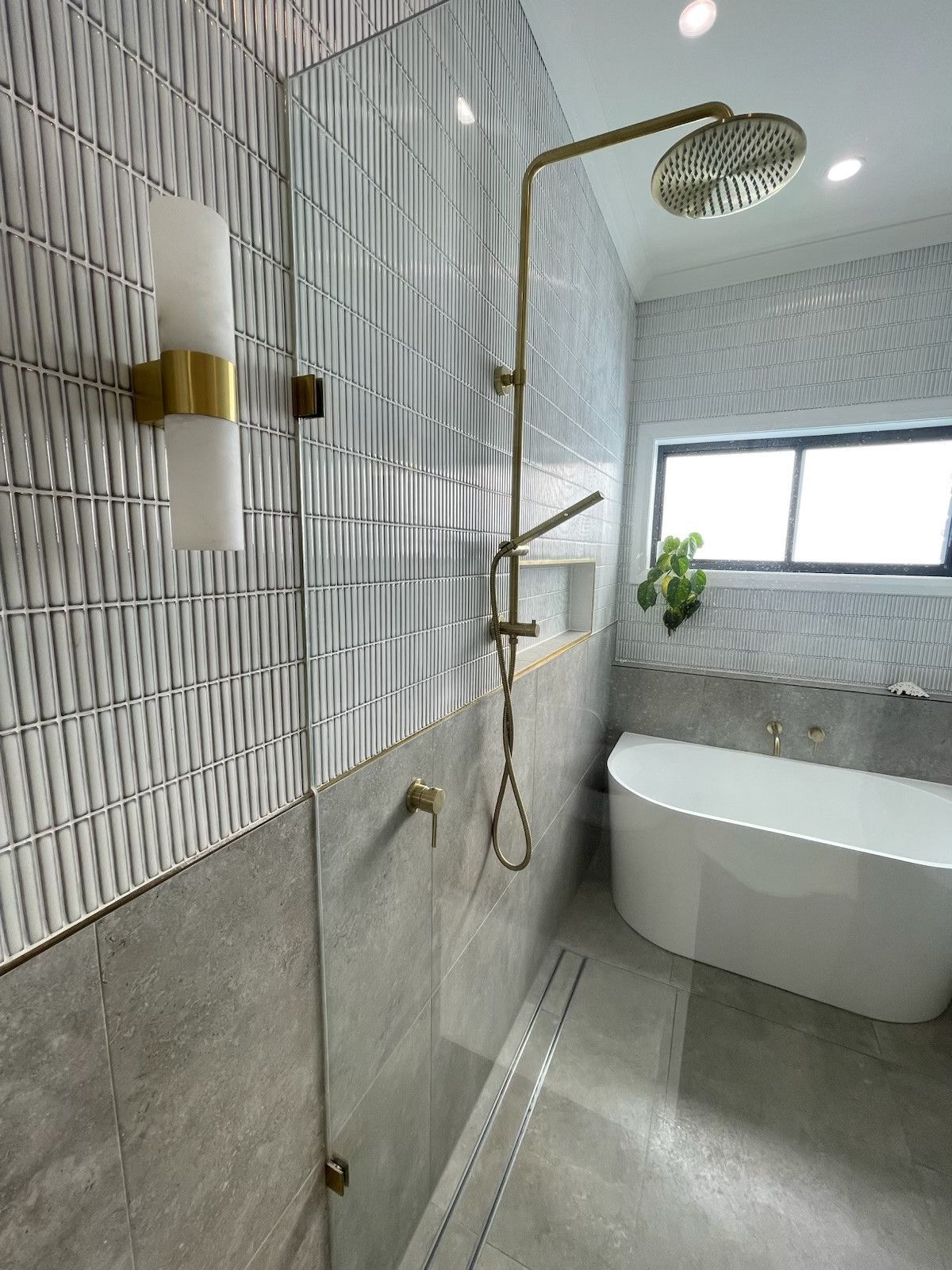 A Modern Bathroom With Large Shower, Soaking Tub — Hallam & Sons in Beard, ACT