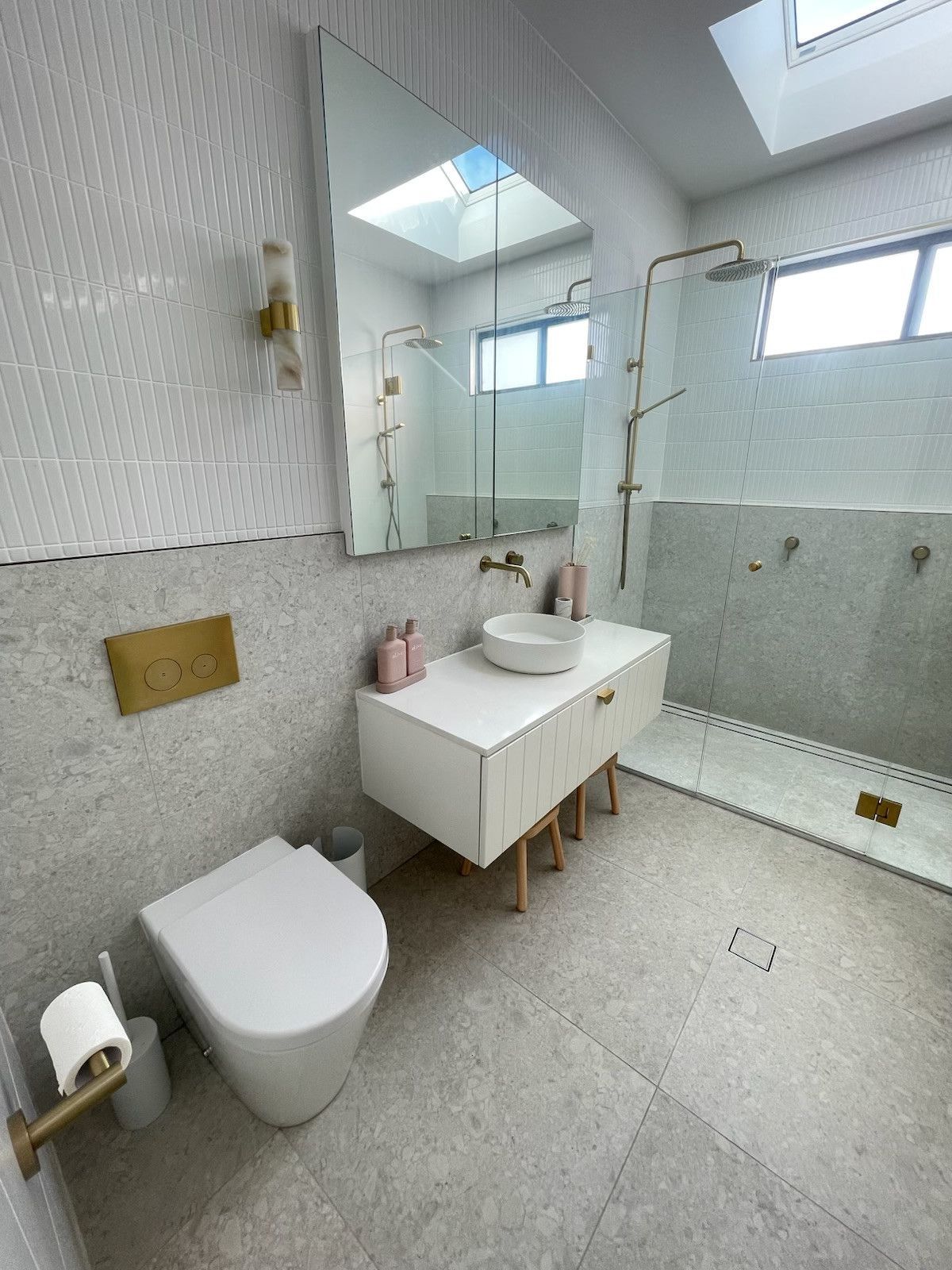 A Modern Bathroom With a White Freestanding Bathtub, Two Vessel Sinks, and Three Windows — Hallam & Sons in Beard, ACT