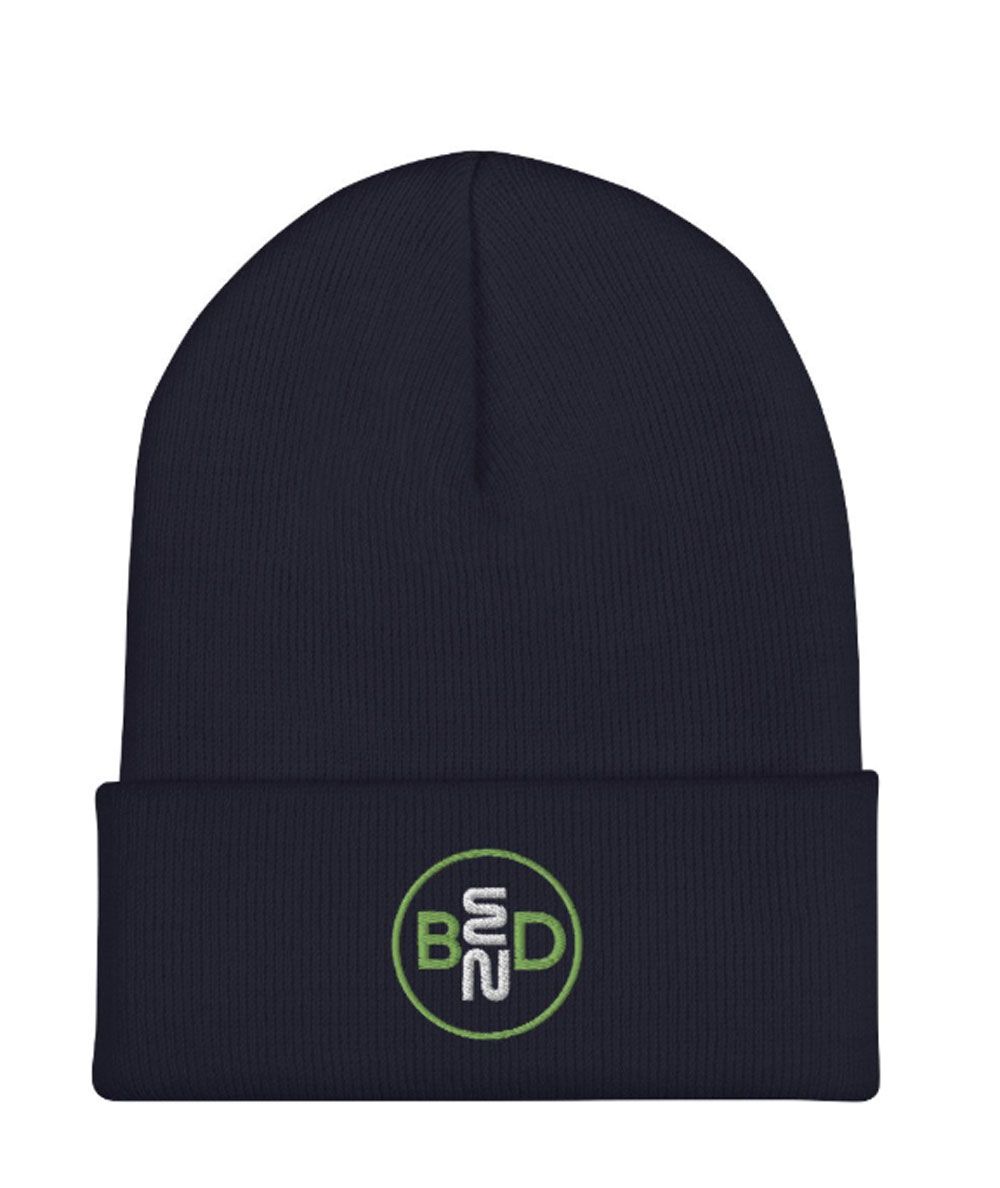 Dark navy beanie with folded cuff and small green circular logo on the front