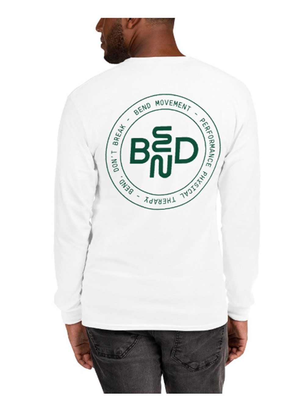 Back view of a man wearing a white long-sleeve shirt with a green circular logo on the back