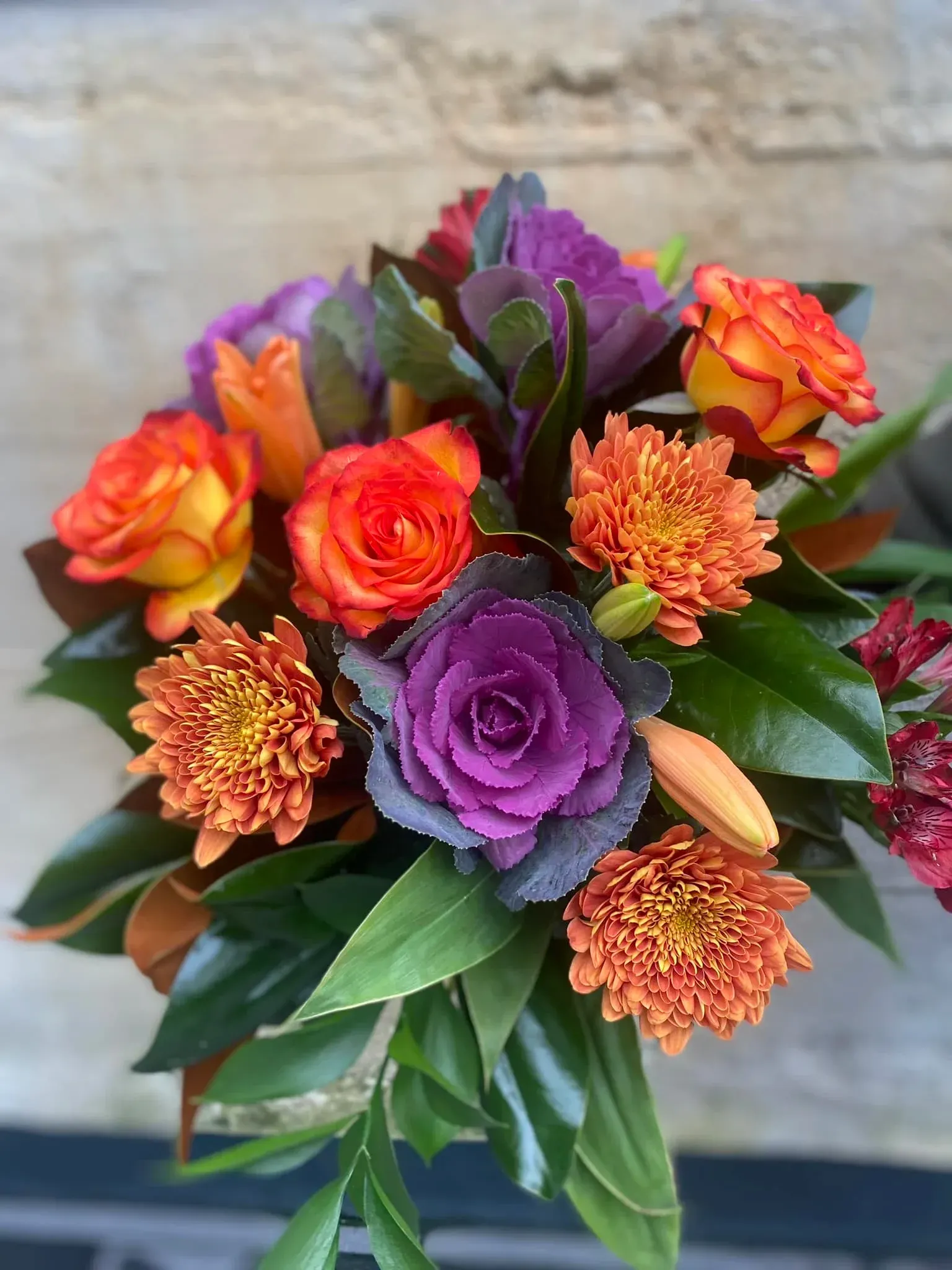 A close up of a bouquet of flowers in a vase.