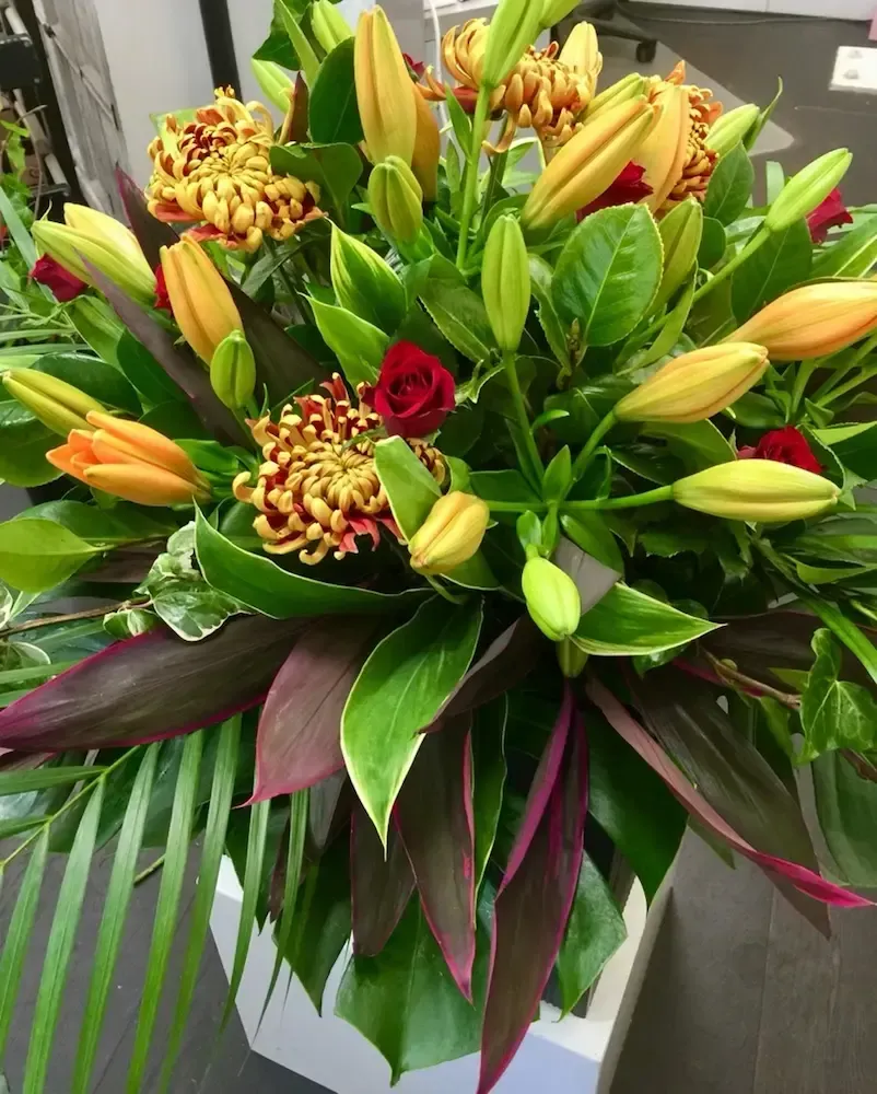 A bouquet of flowers is sitting on a table