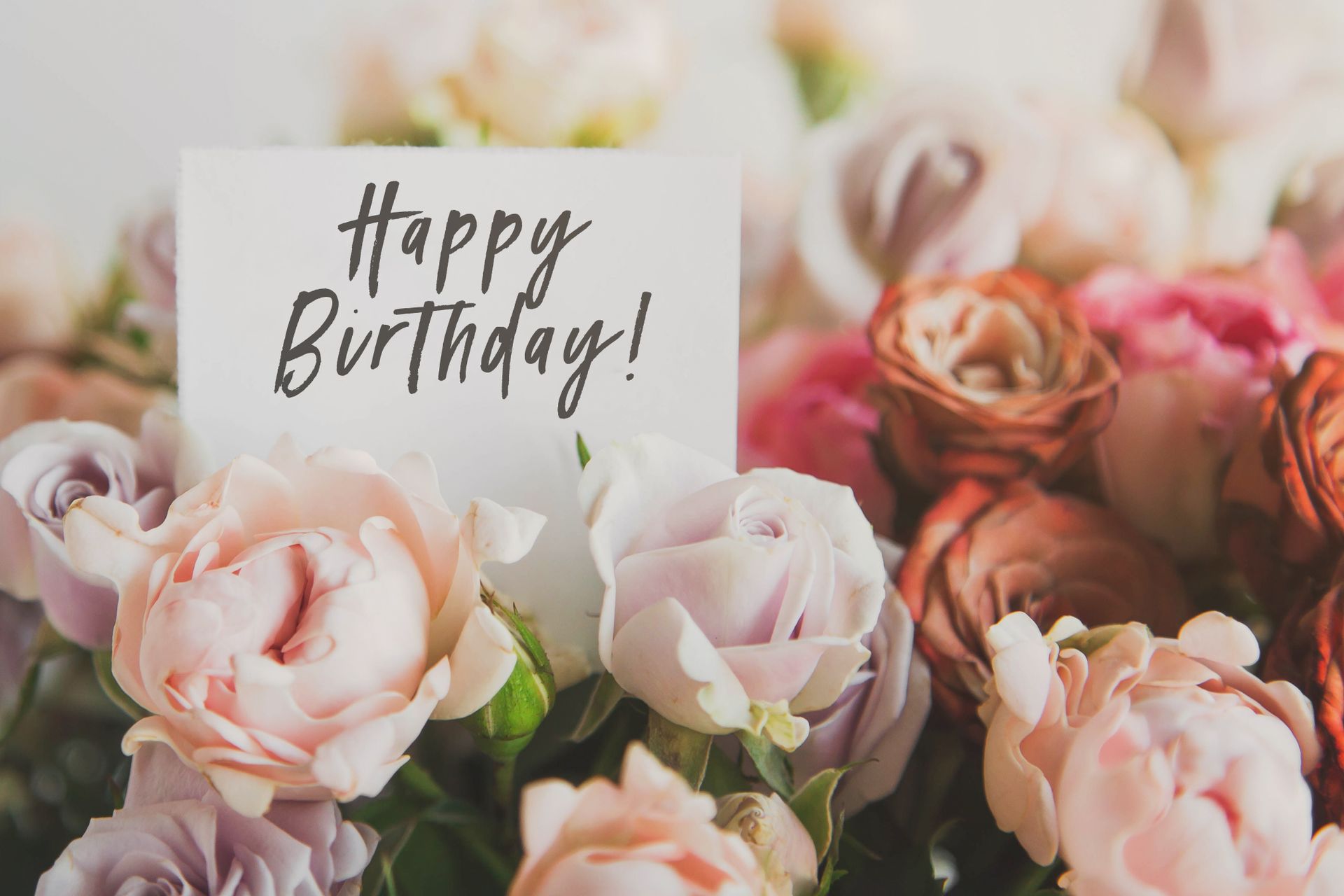 Happy Birthday card with pastel roses and handwritten text