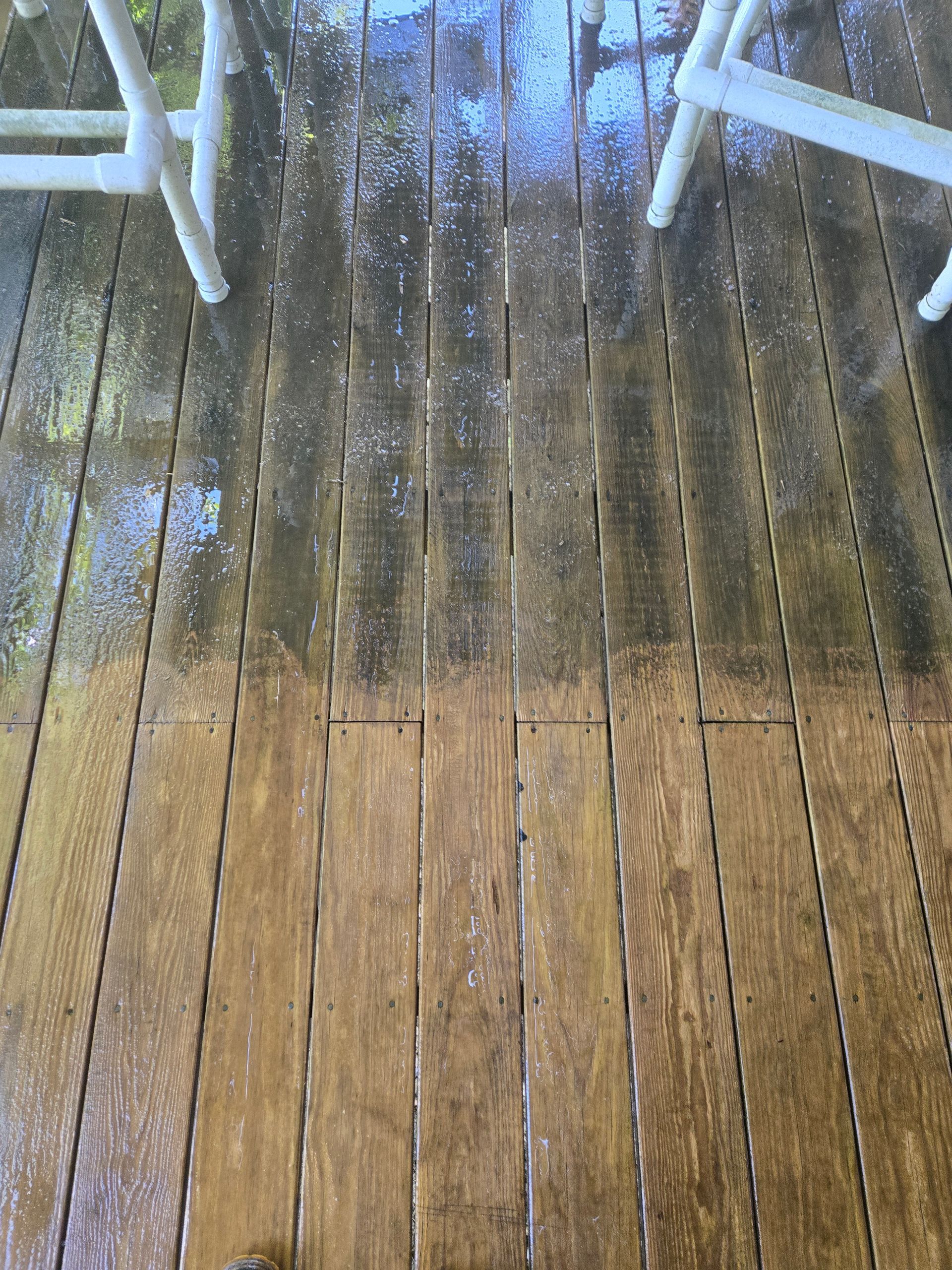 A before and after picture of a wooden deck with chairs.