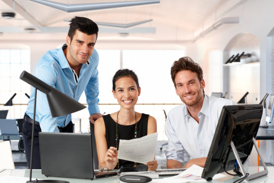 A man is giving a presentation to a group of business people.