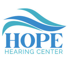 The logo for louisville family audiology is a blue and green infinity symbol.