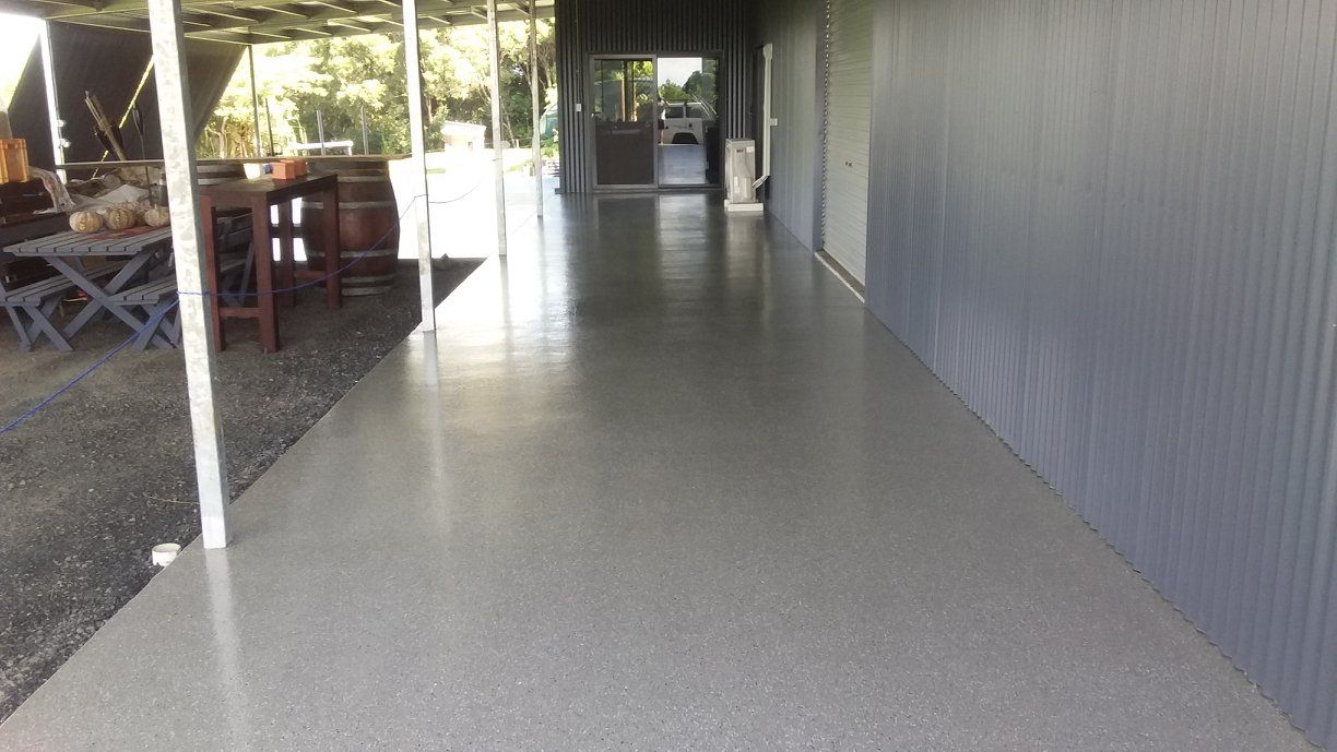 Long Hallway With a Table and Chairs in the Background — Australian Epoxy Floors in Rockhampton, QLD