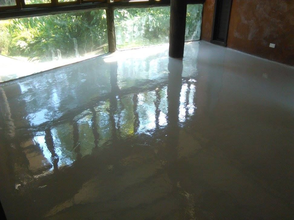 Shiny, Light Gray Floor Reflecting Sunlight and the Outside — Australian Epoxy Floors in Rockhampton, QLD