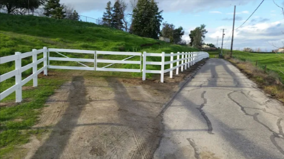 Backyard Fence Installation Fresno CA by The Fence Company featuring durable white ranch-style fence