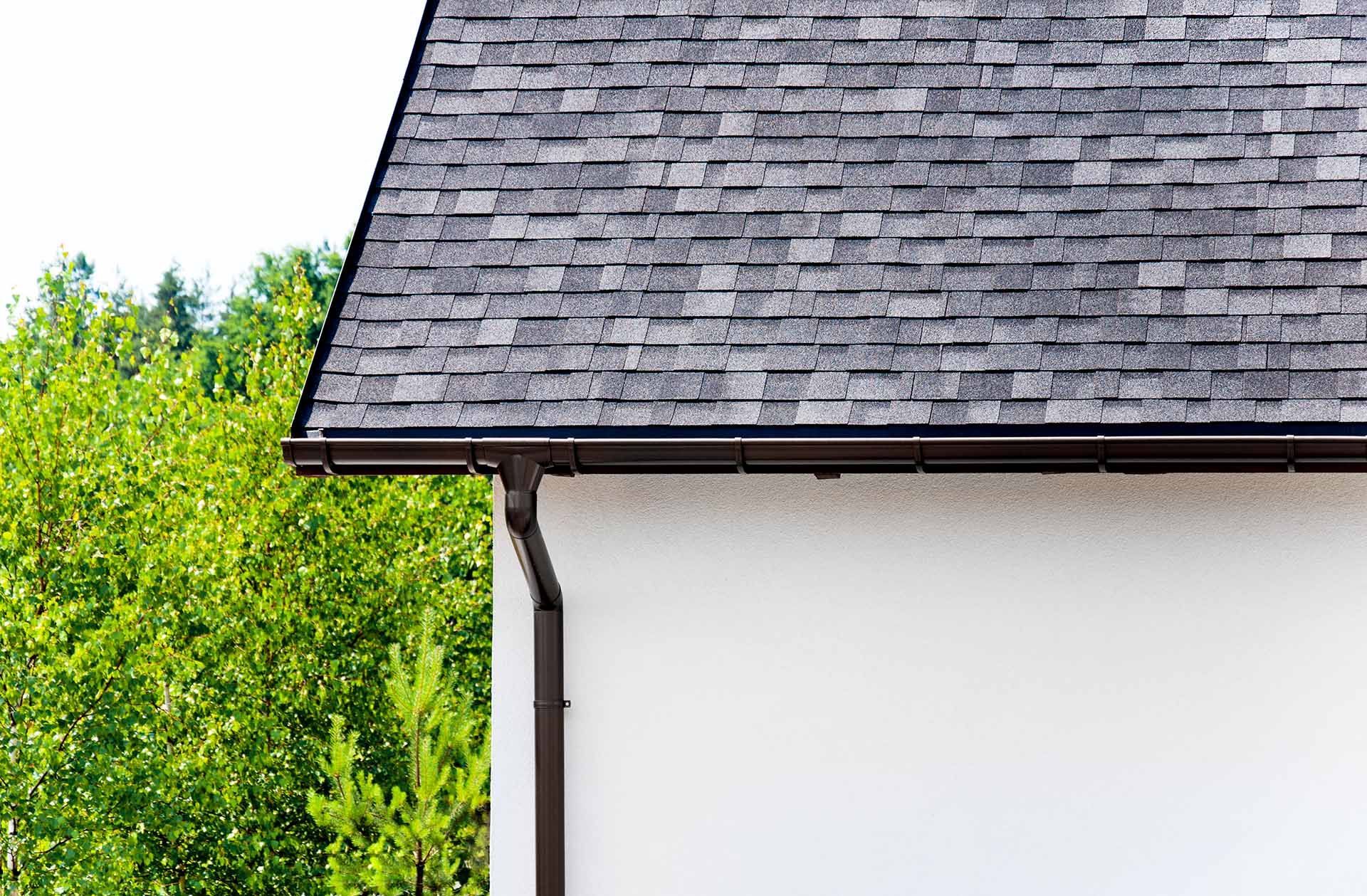 Close-up of brown gutter — Mount Wolf, PA — Dover Roofing Services