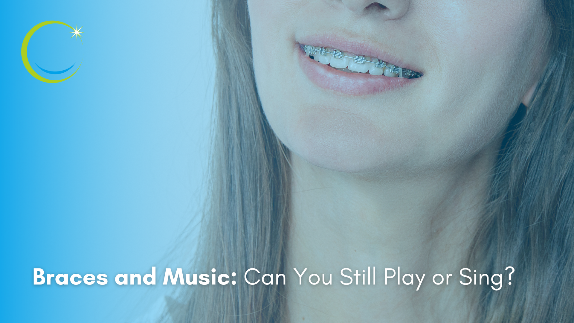 A woman with braces on her teeth is smiling.