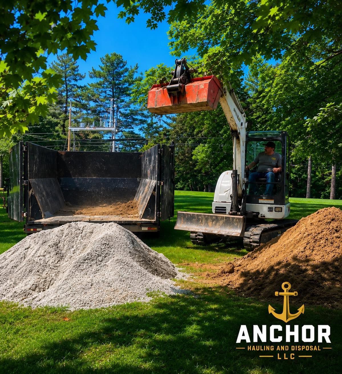 Loader dumping gravel beside two piles on a grassy site under trees, with Anchor logo at bottom right
