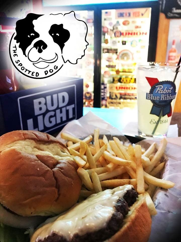 A burger and fries, a beer, and a drink at The Spotted Dog bar.