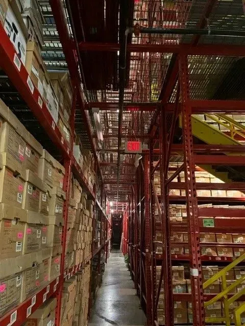 A warehouse filled with lots of boxes and shelves
