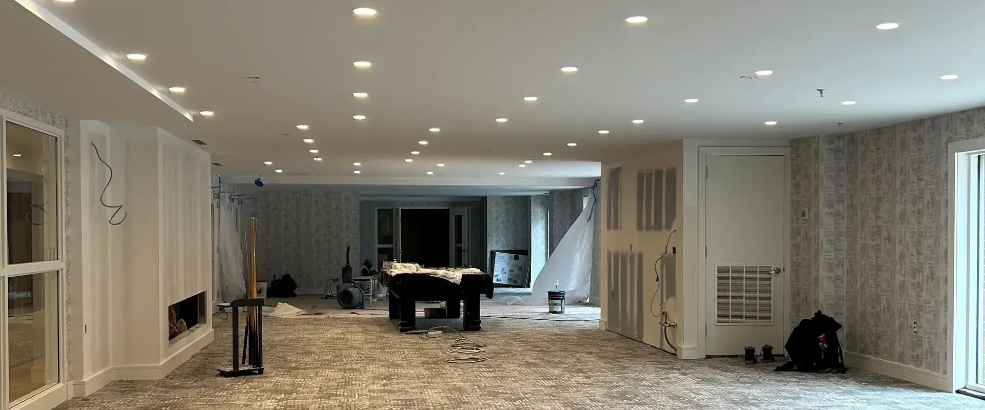 There is a pool table in the middle of the room.