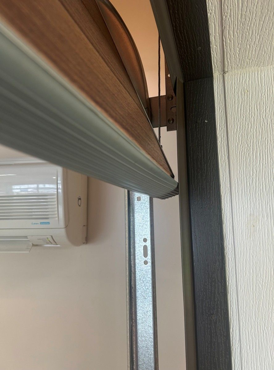 Gray bottom rubber serves to seal across the bottom of the garage door Gray bottom rubber serves to seal across the bottom of the garage door