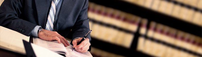 man signing document