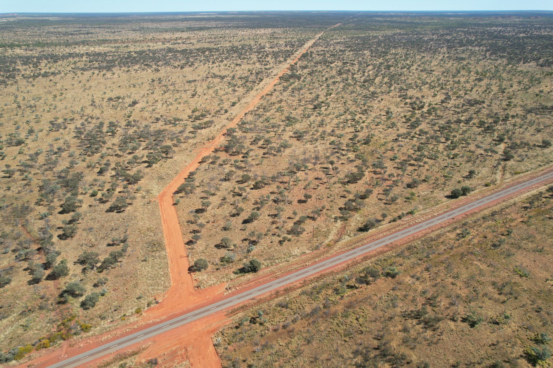 An Aerial View of a Dirt Road in the Desert — Fewmore Contracting In Tennant Creek, NT