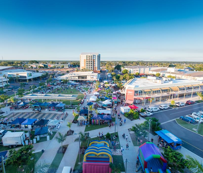An Aerial View Of A City With A Lot Of People And Buildings — Fewmore Contracting in Palmerston, NT