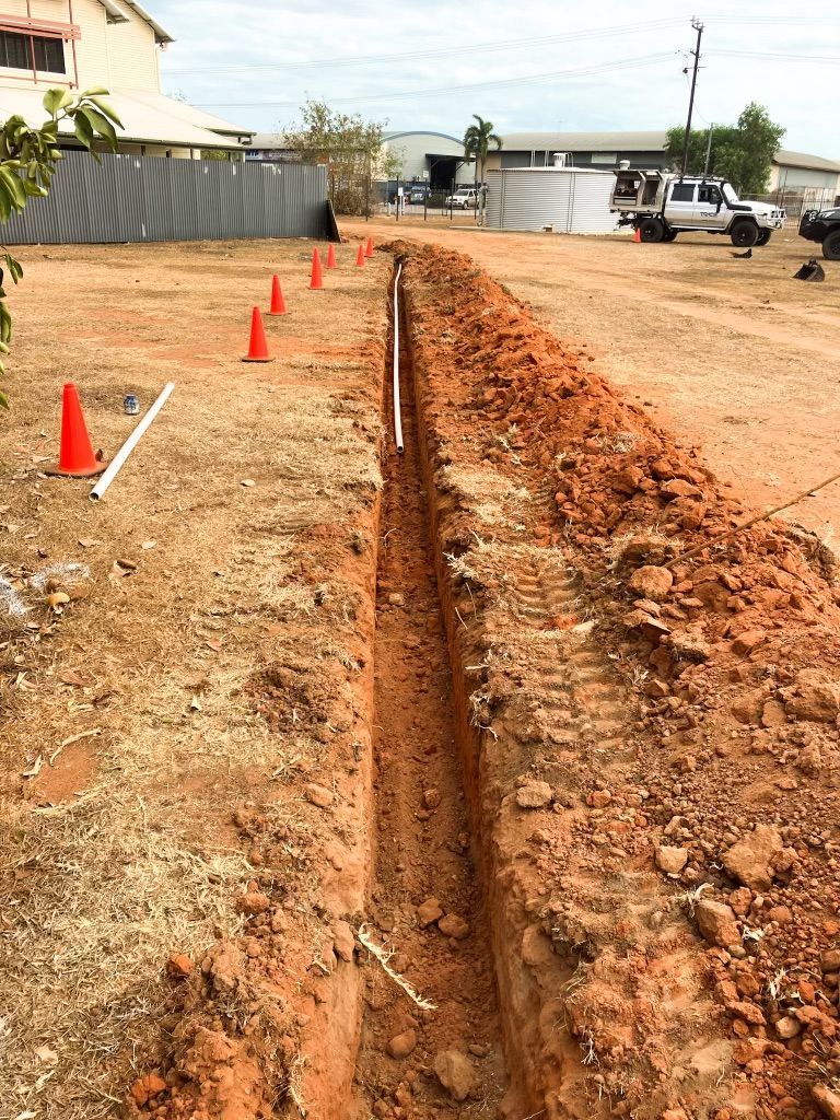 A Trench is Being Dug in the Dirt — Fewmore Contracting In Tennant Creek, NT