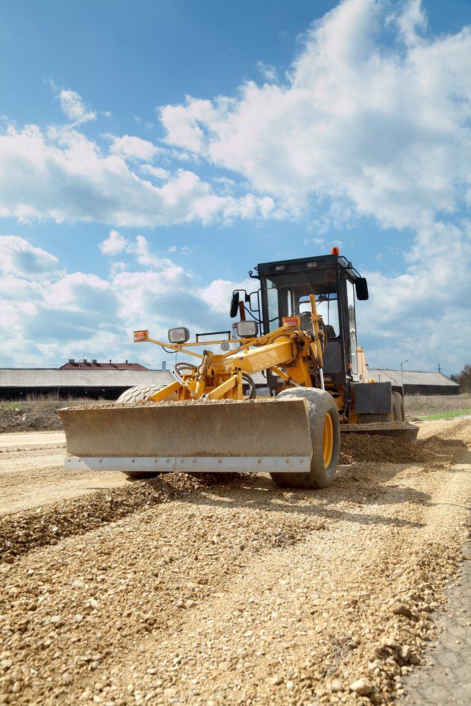 Excavator Standing in Sandpit with Raised Bucket — Greg Thompson Earthmoving in Pink Lily, QLD