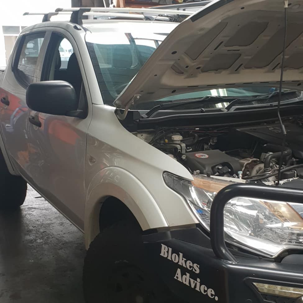 A white truck with the hood open has a sticker on the front that says blokes advice β Sebring All Mechanical Repairs In Mermaid Beach, QLD