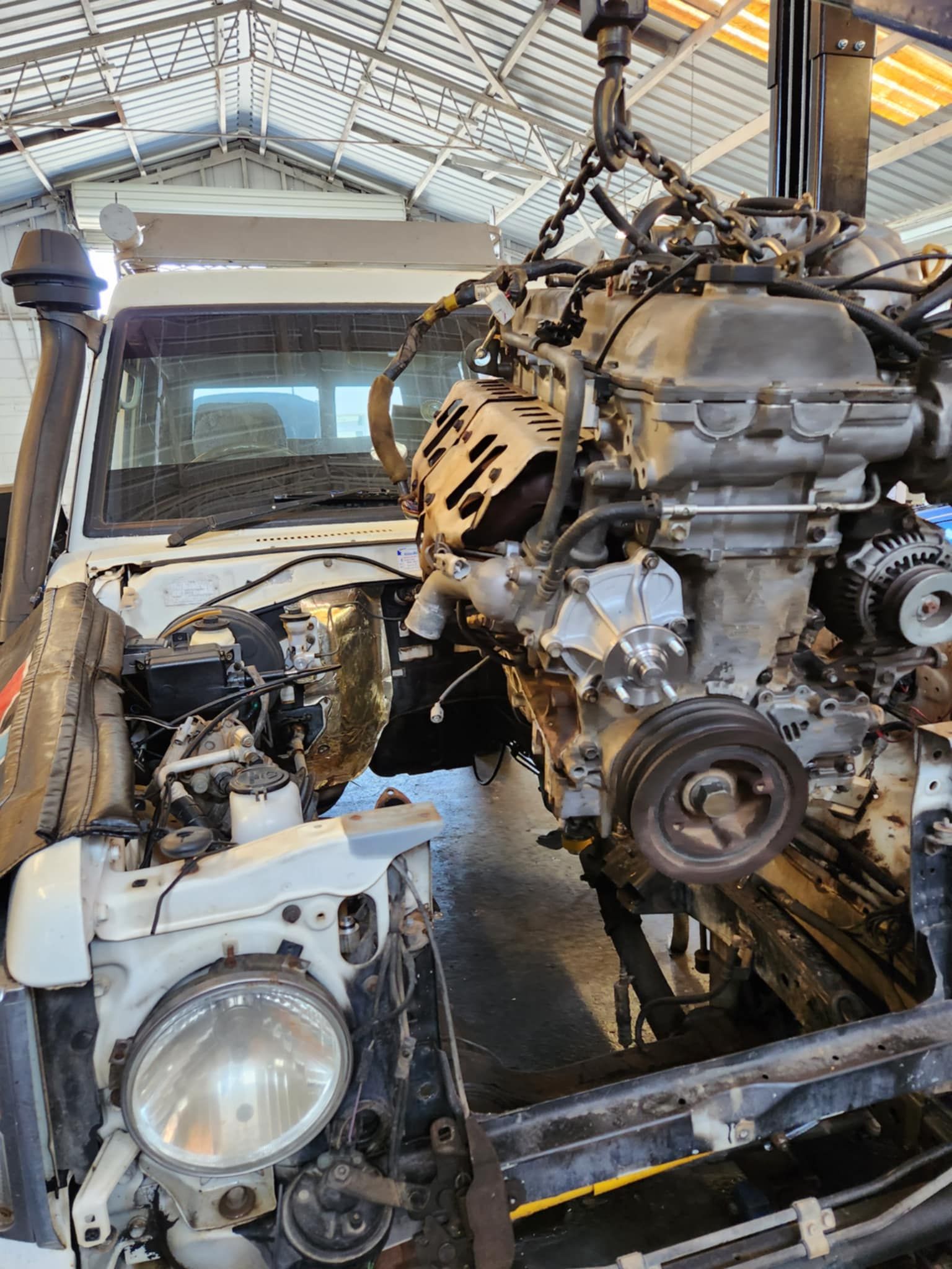 Car Engine Lifted Above A Car β Sebring All Mechanical Repairs In Mermaid Beach, QLD