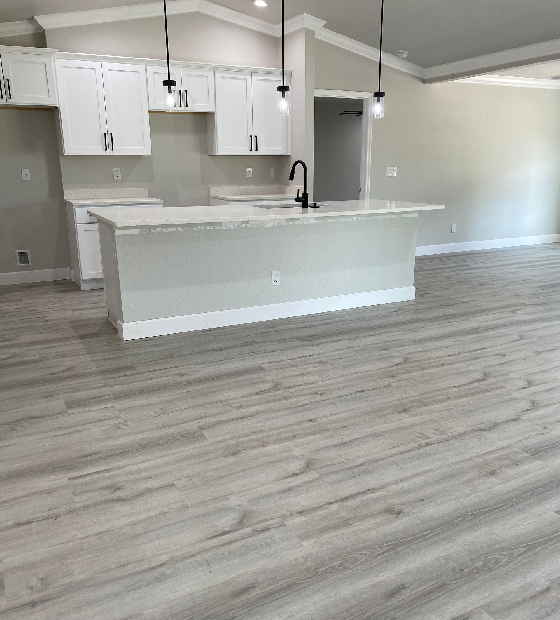 There is a large island in the middle of the kitchen.